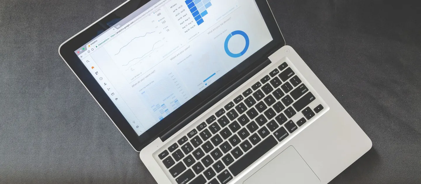 A laptop showing website analytics on a desk