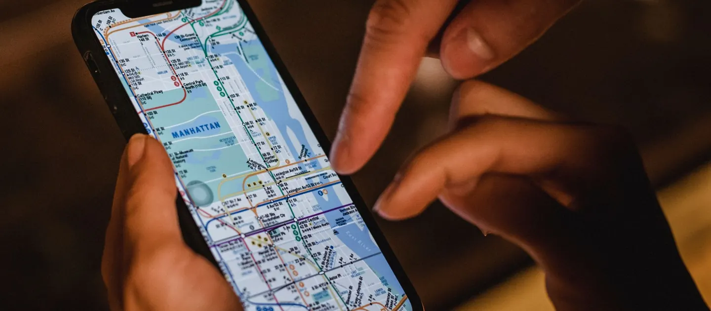 Two people looking at a city map on a phone