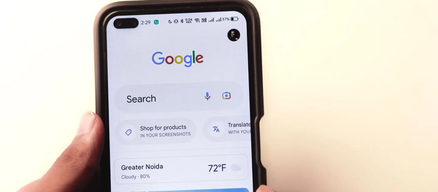 Google search open on a phone held in a hand